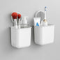 Wall mounted bathroom organizer cups set in use