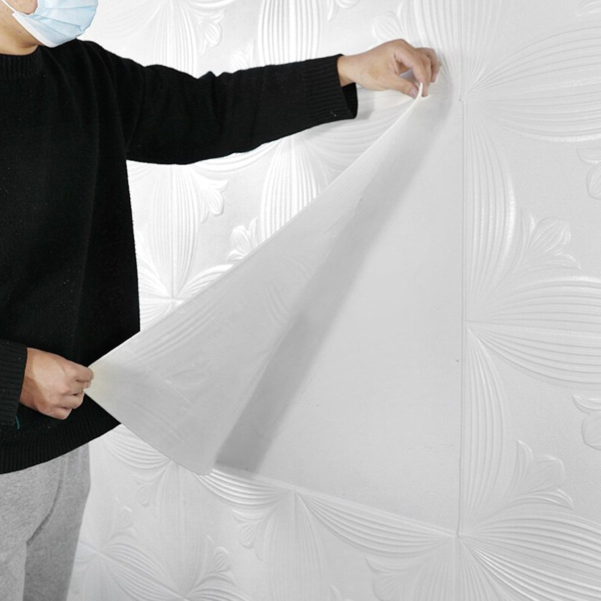 3D foam wallpaper panels applied to a ceiling for a modern look.