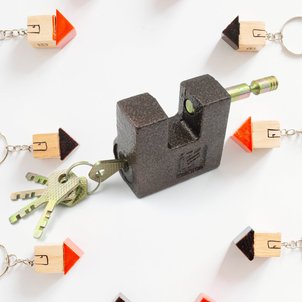 Heavy-duty black iron door lock installed on a warehouse gate for maximum security against intruders.