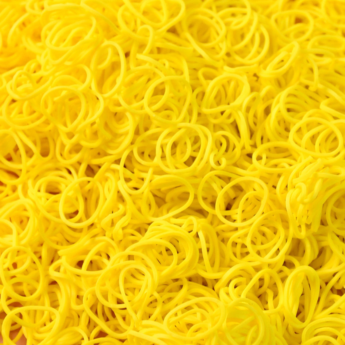 Close-up of durable elastic rubber bands in bright orange