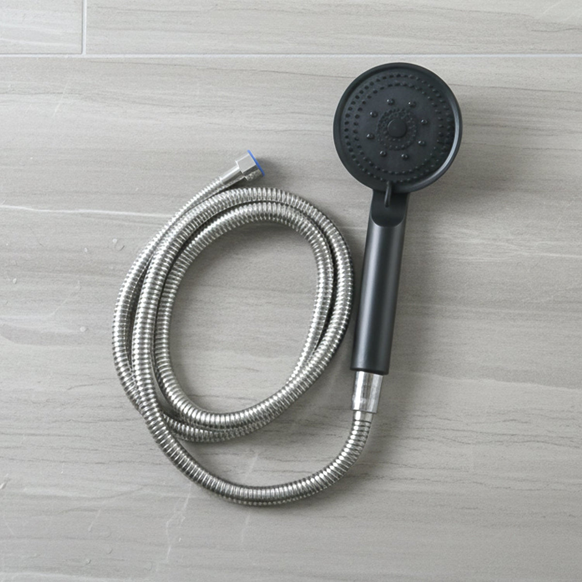 Flexible stainless steel hose connected to shower handle