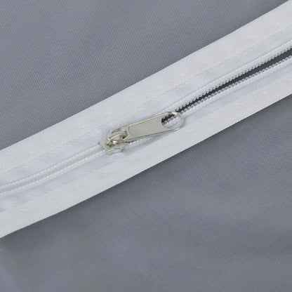 Closeup of full-length zipper on suit cover with breathable fabric.