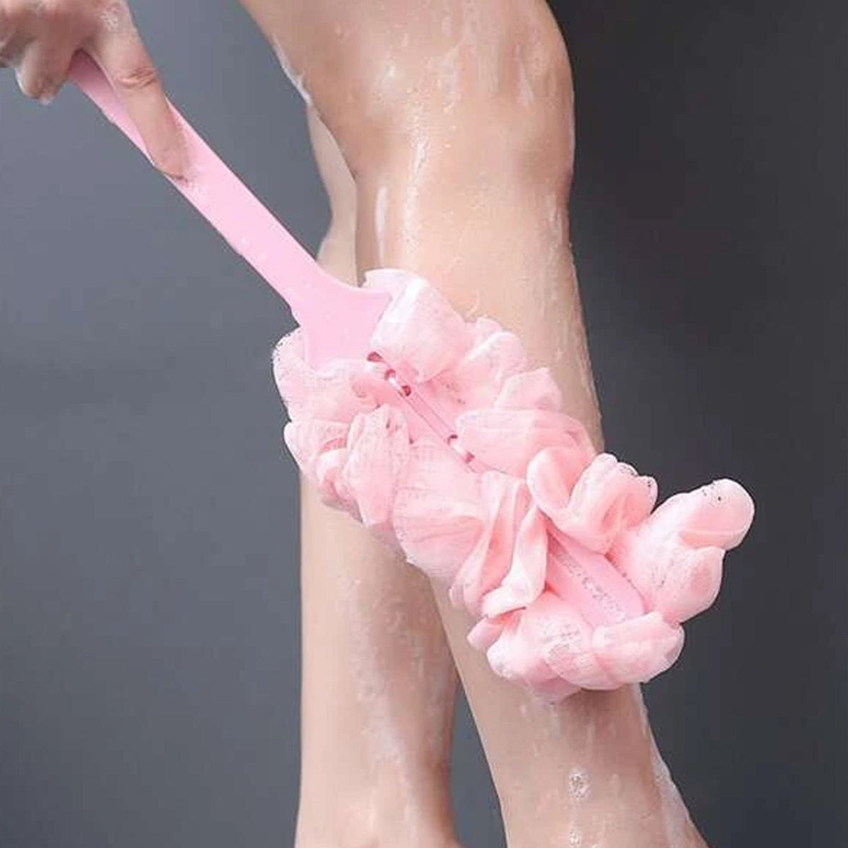 Unisex body bath brush with a long handle, suitable for men and women.