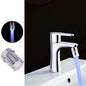 LED faucet light streaming a colorful water flow from kitchen tap