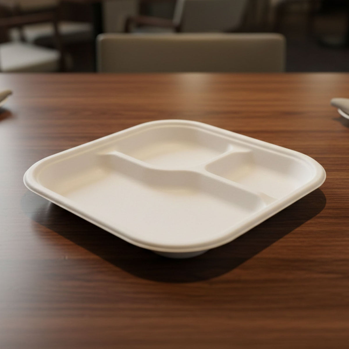 Serving hot food on eco-friendly compostable bagasse 3-compartment meal plate
