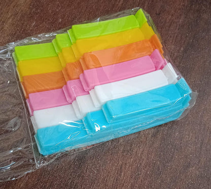 A person demonstrating how to use the food bag clips for sealing.