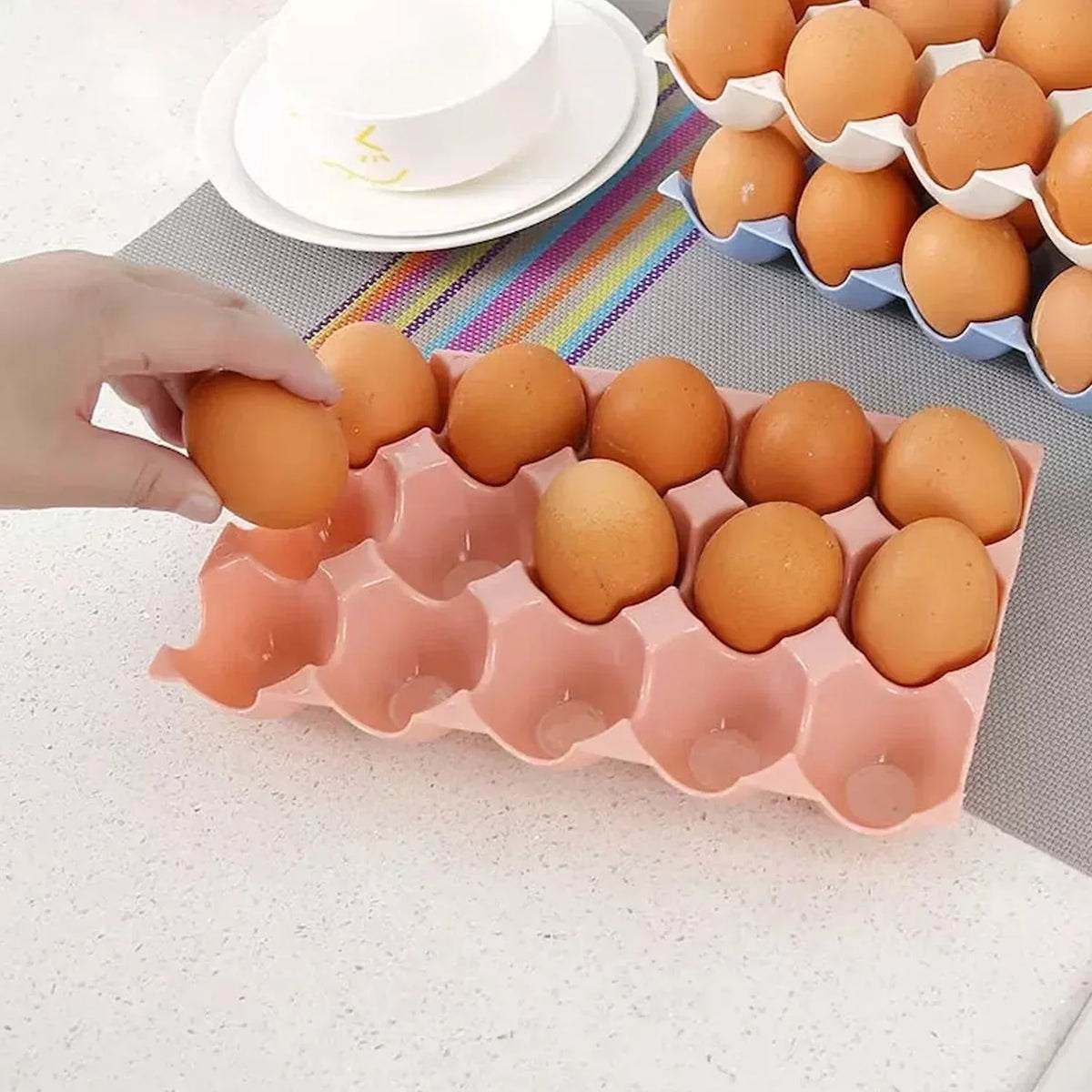 Organivo plastic egg trays neatly stacked, ready for use in a pantry.