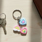 Heart and rainbow charm keychain with multiple colorful hanging charms