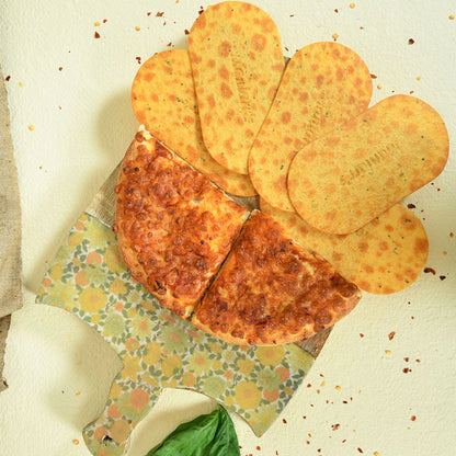 Packaged Maniarr's Pizza Mini Slim Bites with clear pizza flavour branding and nutritional info.