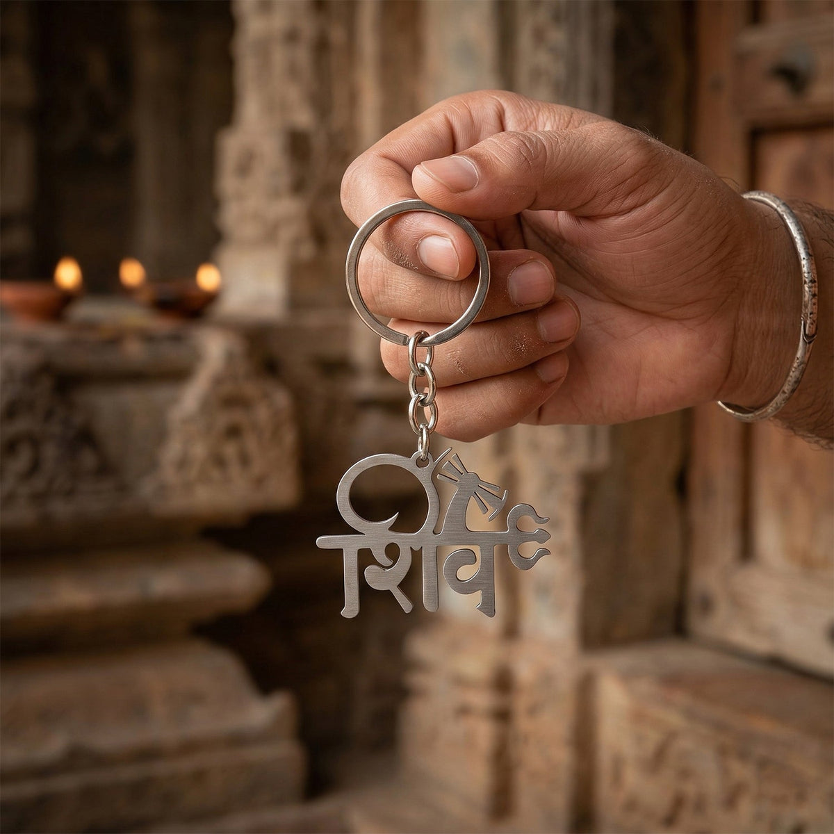 Close-up of intricately designed Shiv idol keychain