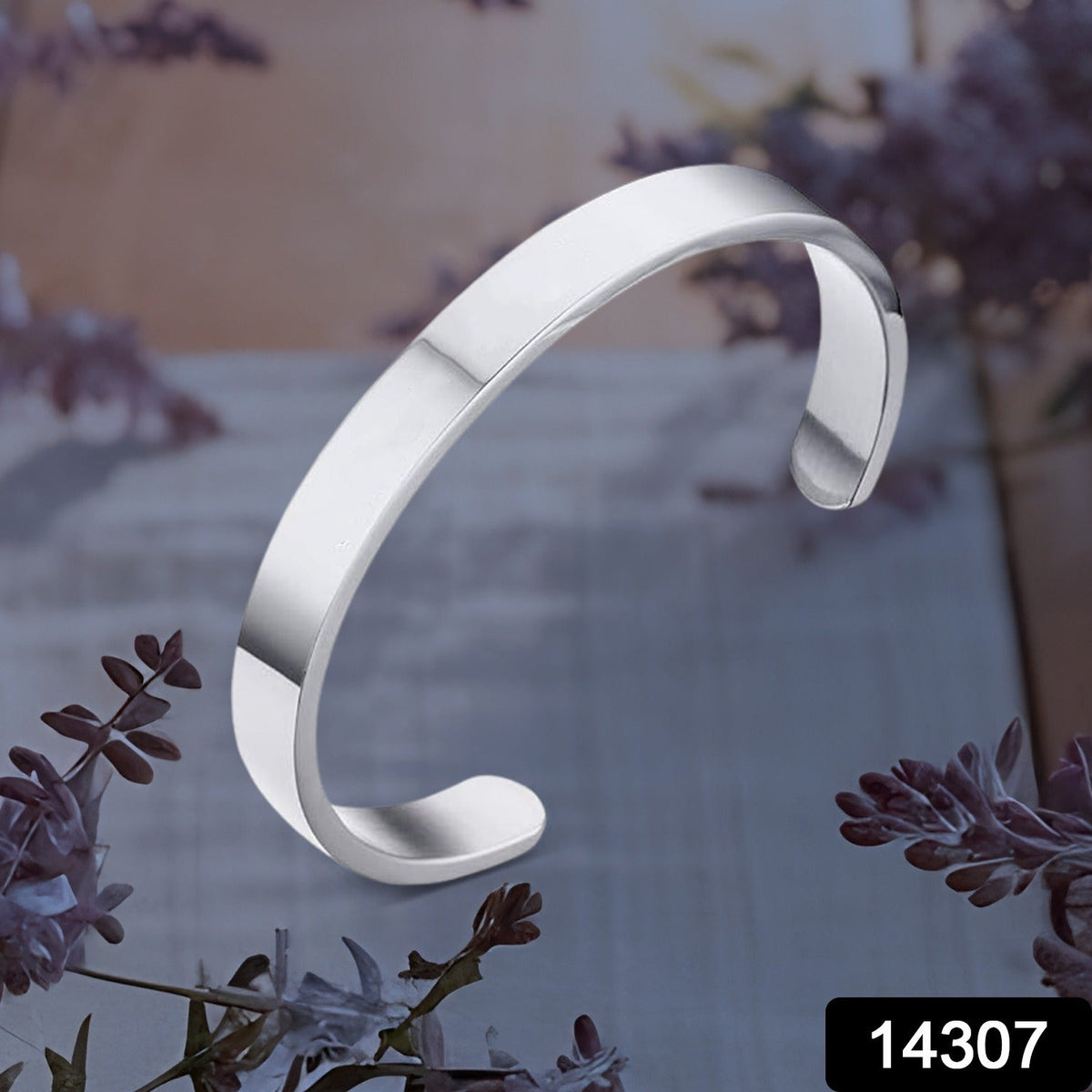 Polished stainless steel cuff bracelet showing smooth silver finish
