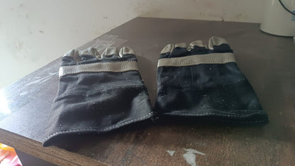Person using BraveVault leather gloves for various outdoor tasks.