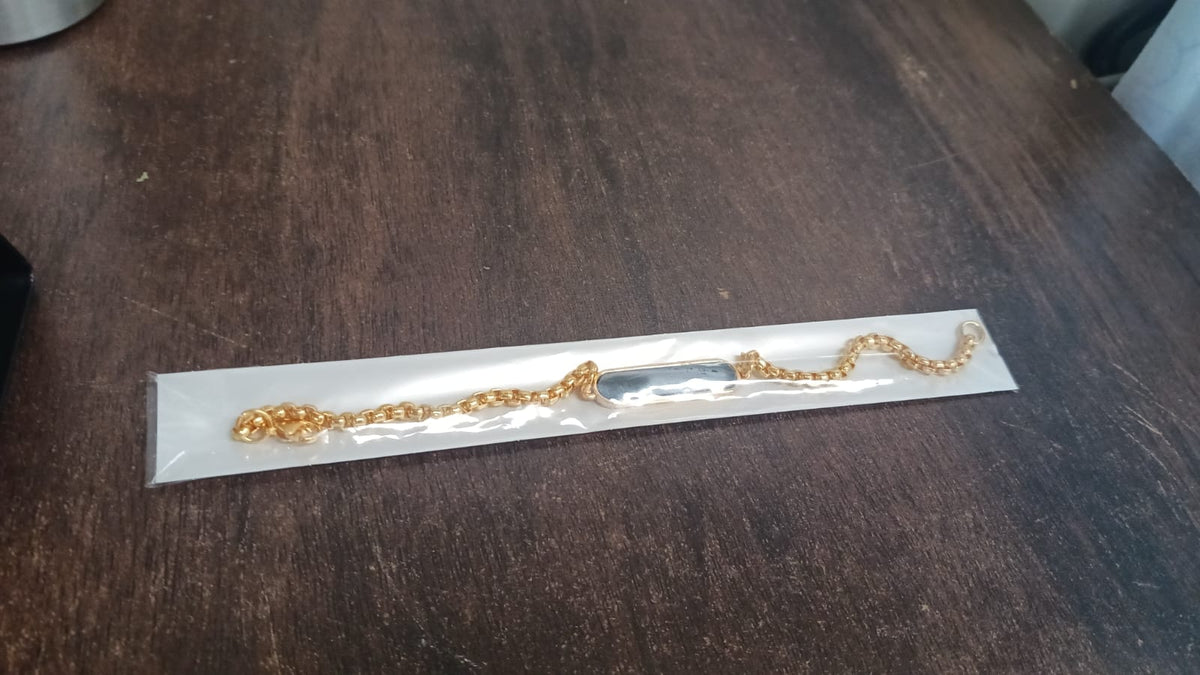 Elegant golden bracelet, ready for personalization.