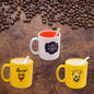 Elegant designer coffee mug with spoon, presented in a gift box.