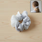 Dual-tone satin mesh hair scrunchie showcasing soft fabric texture